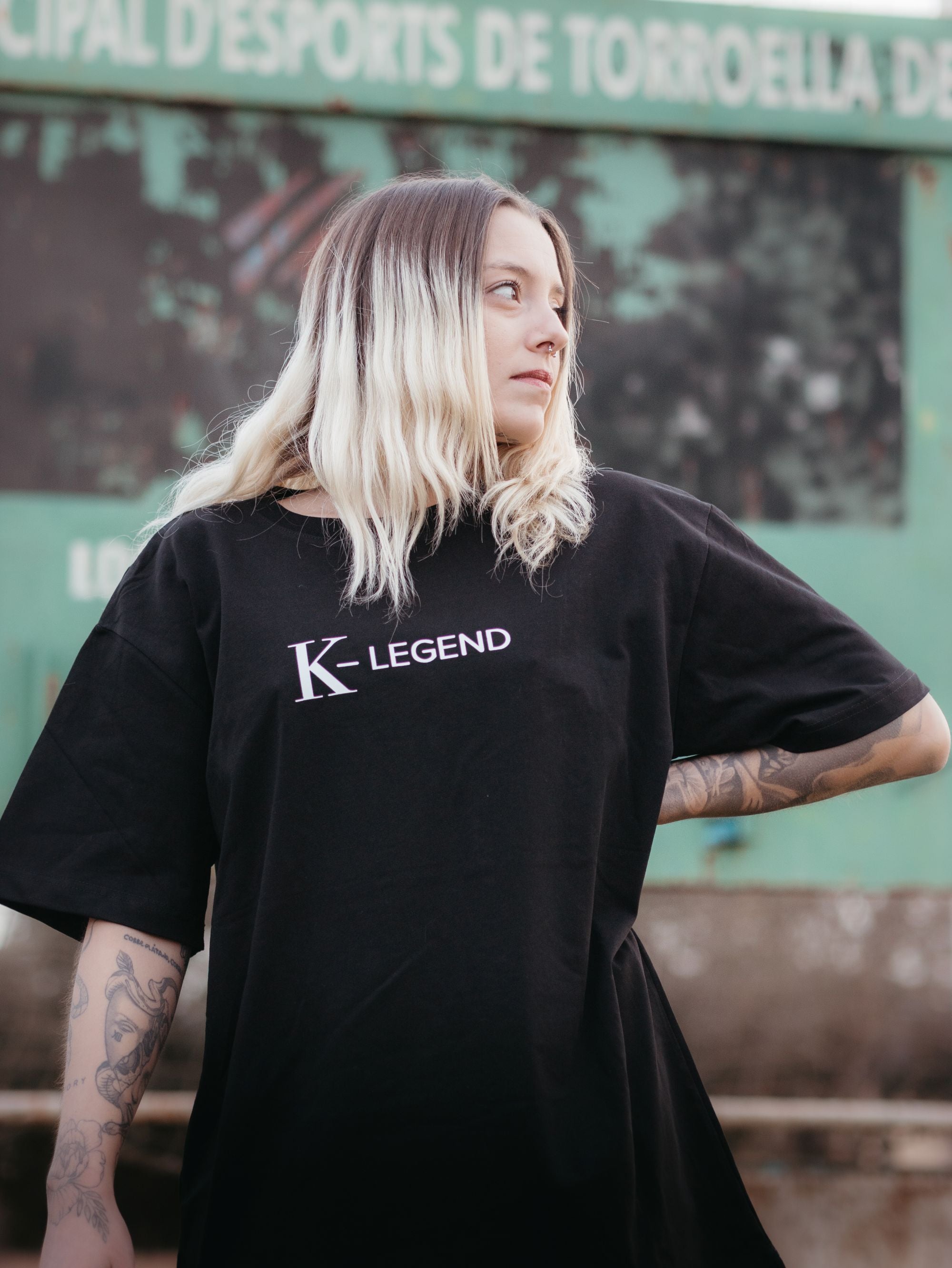 Oversized black t-shirt from K-Legend Collection displayed on a neutral background.