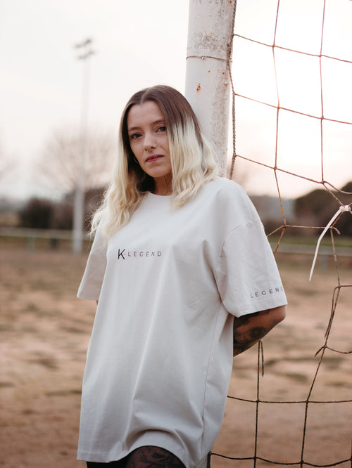 Beige K-Legend Collection essential t-shirt displayed on a neutral background, showcasing its simple design and fabric texture.